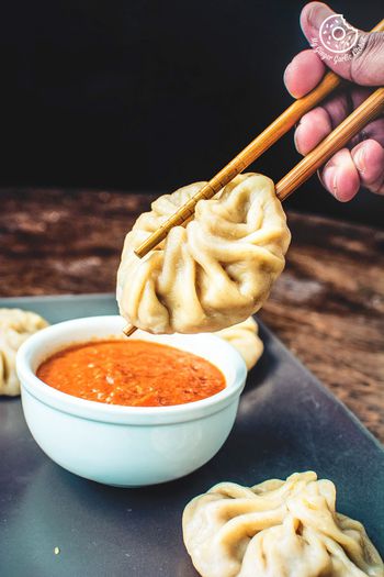 Image of Steamed Vegetable Momos With Spicy Chili Chutney - Dim Sum