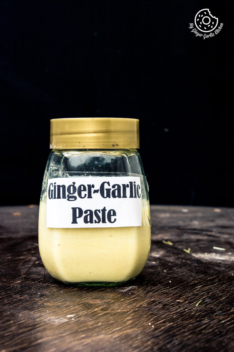 a jar of ginger garlic paste sitting on a table with a label on it