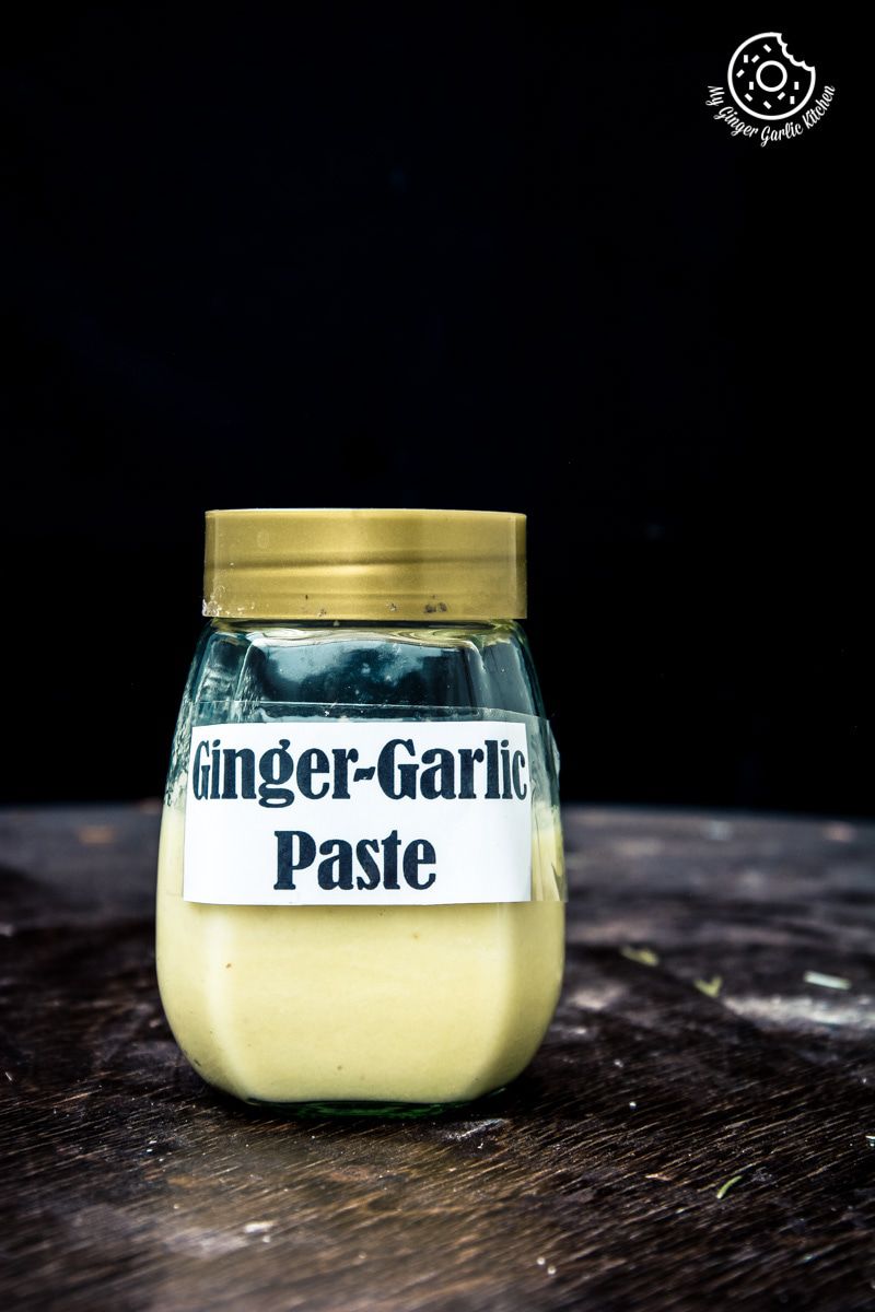 a jar of homemade ginger garlic paste on a table