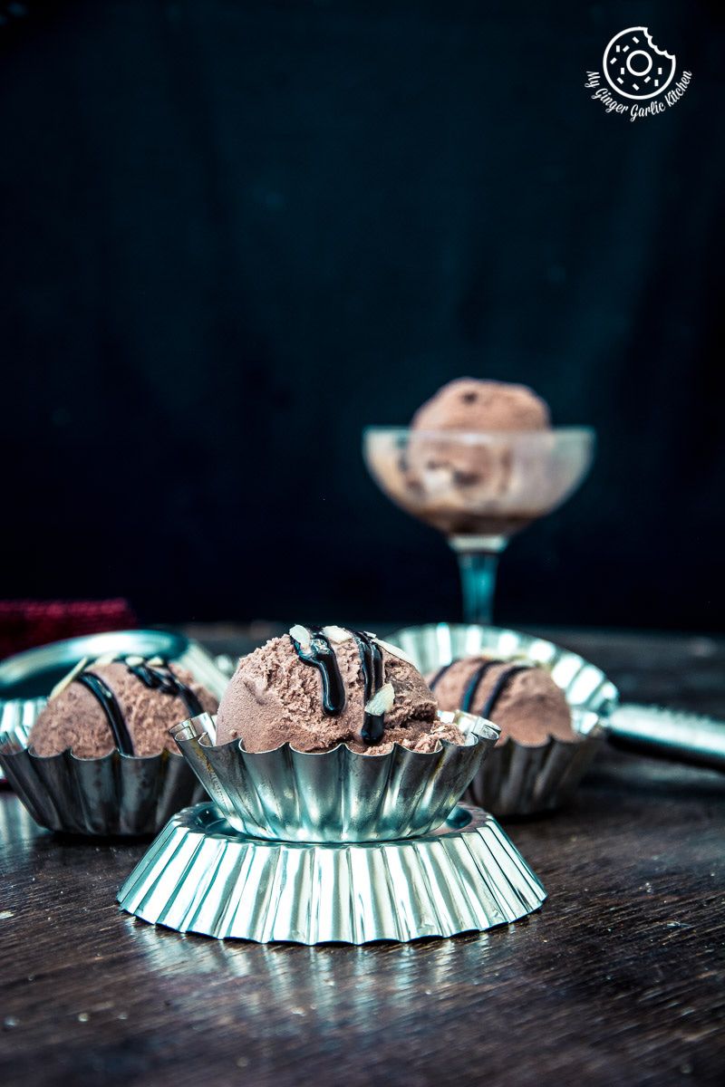 eggless chocolate hazelnut ice cream in a bowl with a spoon