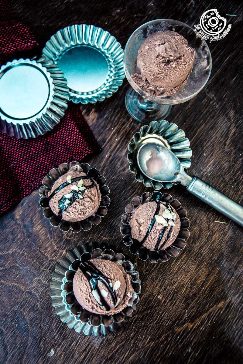 four chocolate hazelnut ice cream in small cups on a table