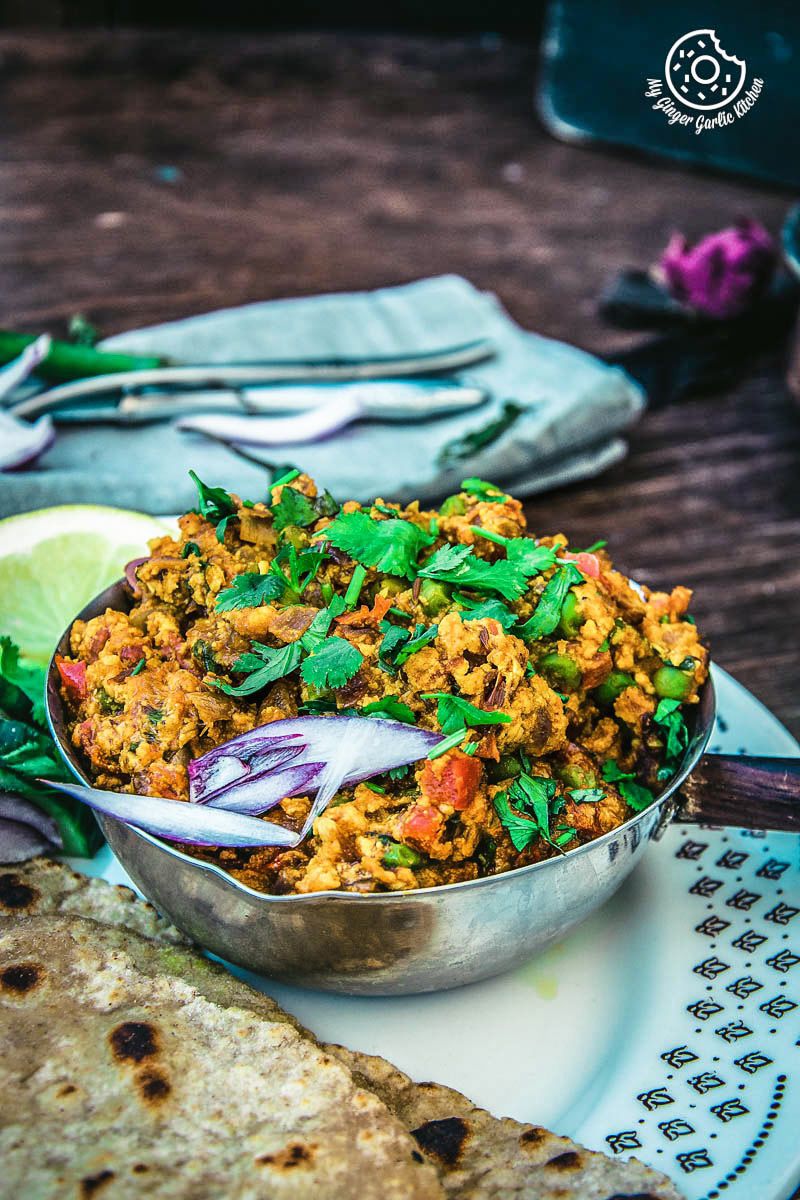 a plate of food with a bowl of punjabi paneer bhurji dry on it