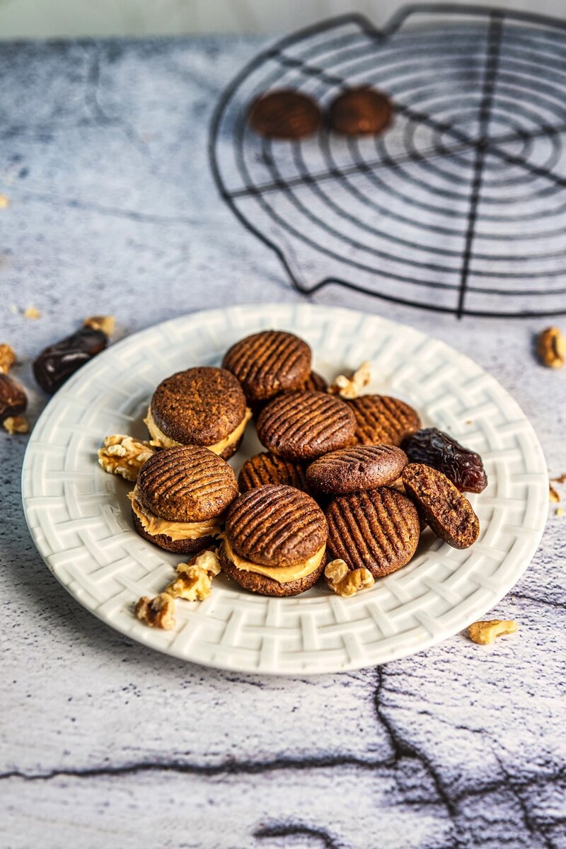 2 ingredient walnut date cookies served on plate, soft chewy healthy dessert with dates and walnuts