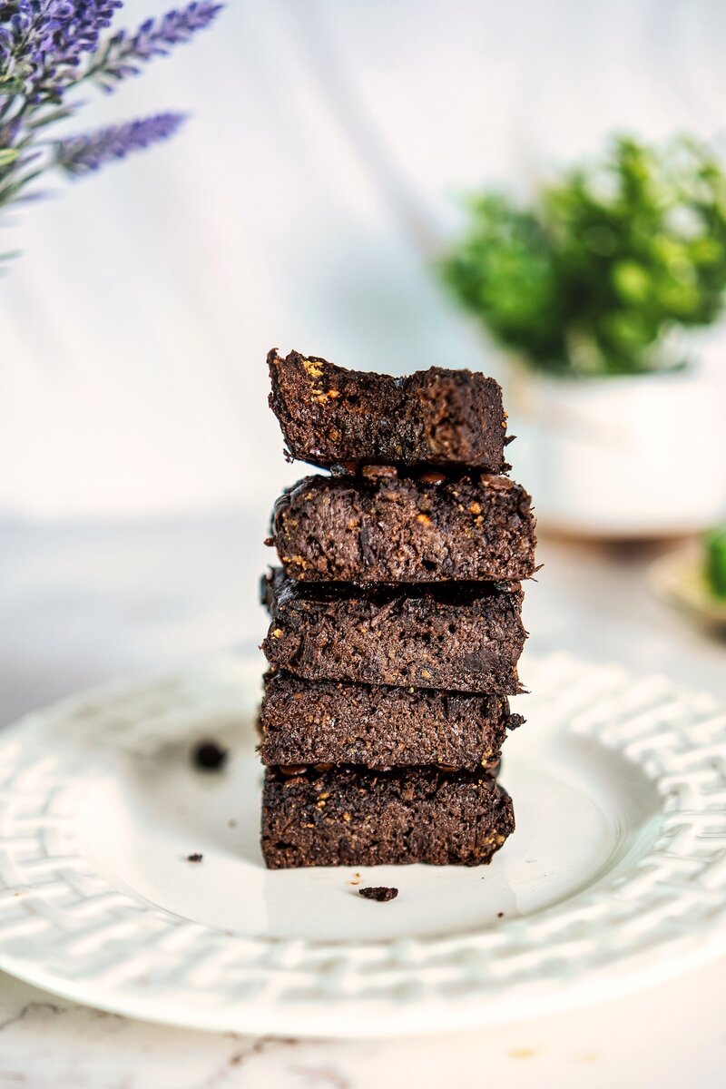 Stacked 3-ingredient banana peanut butter brownies showing fudgy texture and chocolatey interior