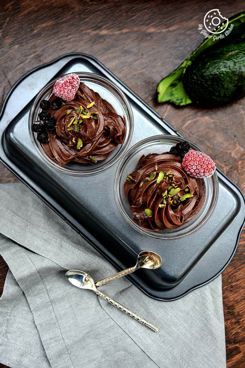 two avocado chocolate mousse in a pan on a table