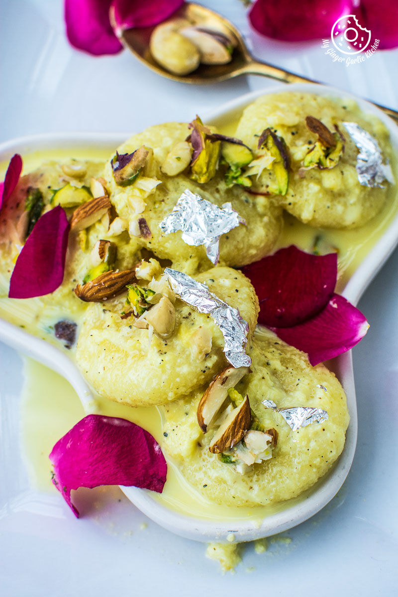 a white plate with soft rasmalai on it