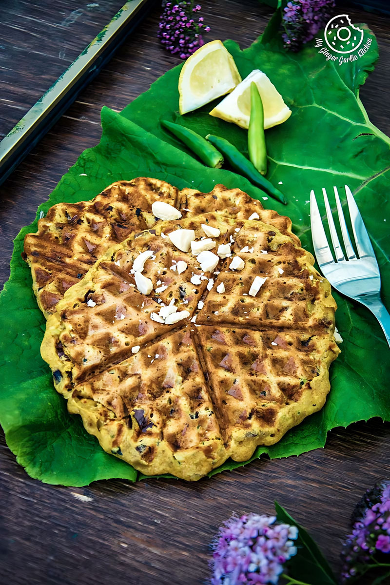 besan chilla waffles on a leaf with a fork and knife