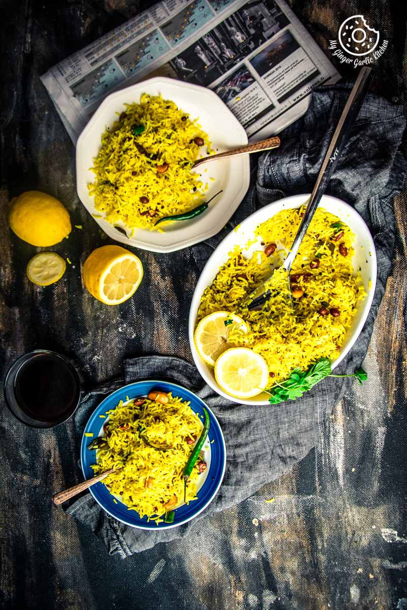 three plates of south indian lemon rice and some lemon slices