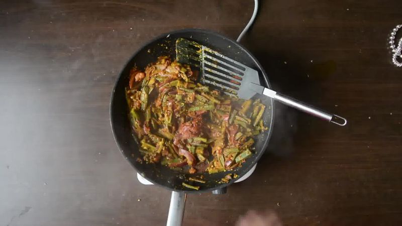 Image of the recipe cooking step-1-11 for Achaari Dahi Bhindi with Duppad Roti - Pad Wali Roti