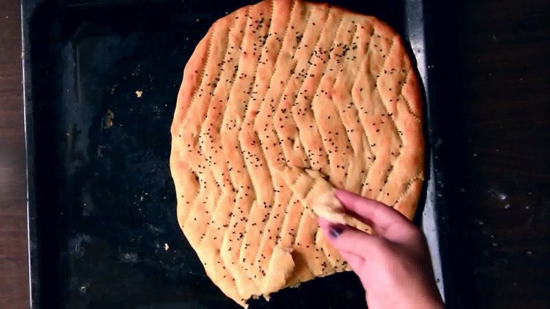 Image of the recipe cooking step-2-10 for Afghan Naan Bread Recipe - Naan-e-Afghani (Video)