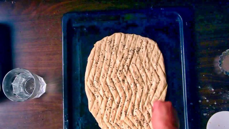 Image of the recipe cooking step-2-7 for Afghan Naan Bread Recipe - Naan-e-Afghani (Video)