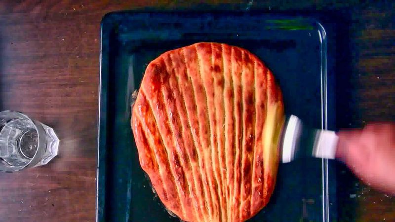 Image of the recipe cooking step-2-9 for Afghan Naan Bread Recipe - Naan-e-Afghani (Video)