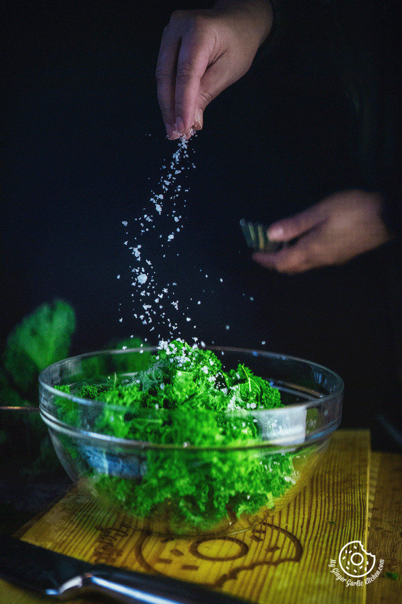 image of salt sprinkling over Kale leaves
