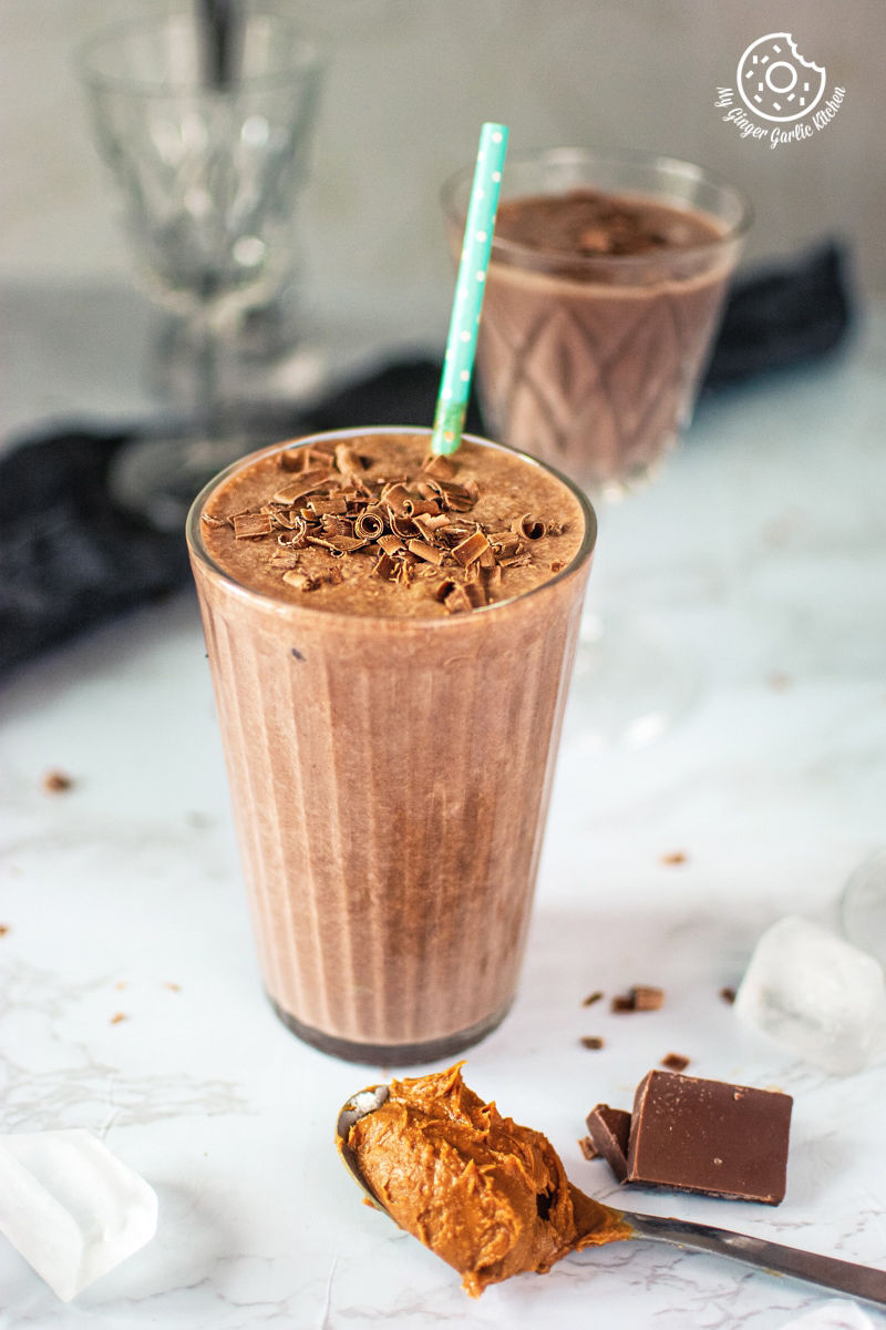 easy chocolate peanut butter banana smoothie served in a tall glass
