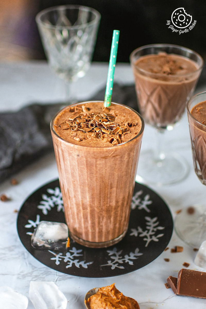 easy chocolate peanut butter banana smoothie served in a tall glass