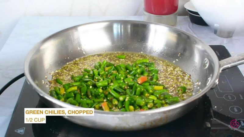 Image of the recipe cooking step-1-6 for Besan Mirchi Ke Tipore - Garm Flour Green Chili Stir-Fry
