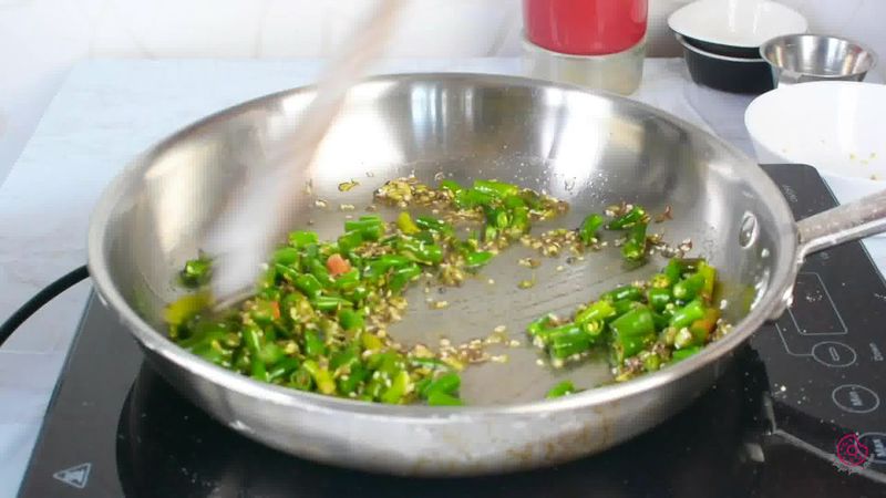 Image of the recipe cooking step-1-7 for Besan Mirchi Ke Tipore - Garm Flour Green Chili Stir-Fry