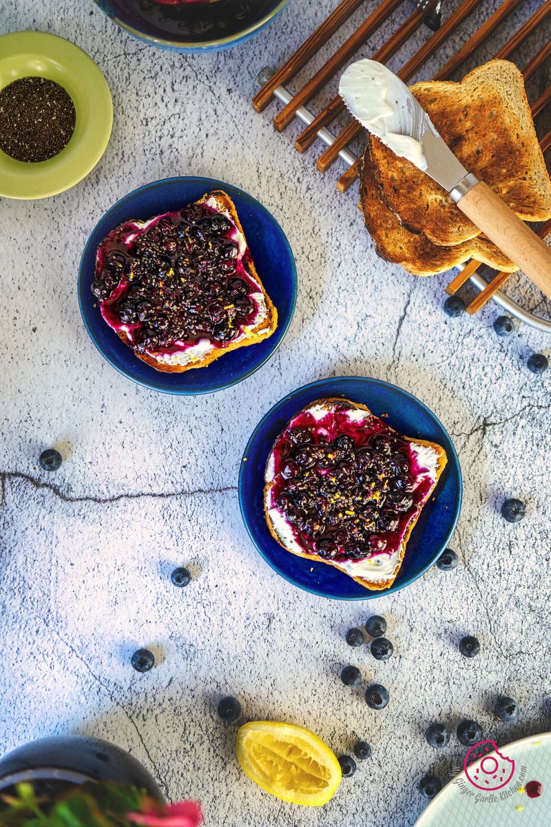 flatlay of two blueberry toasts served in blue plate