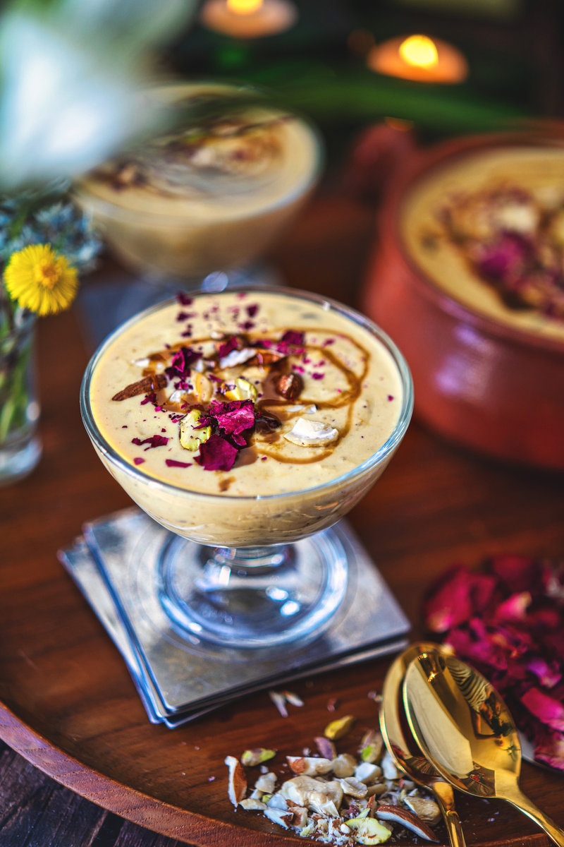 Close-up view of caramel kheer in a glass bowl, beautifully garnished and ready to serve.