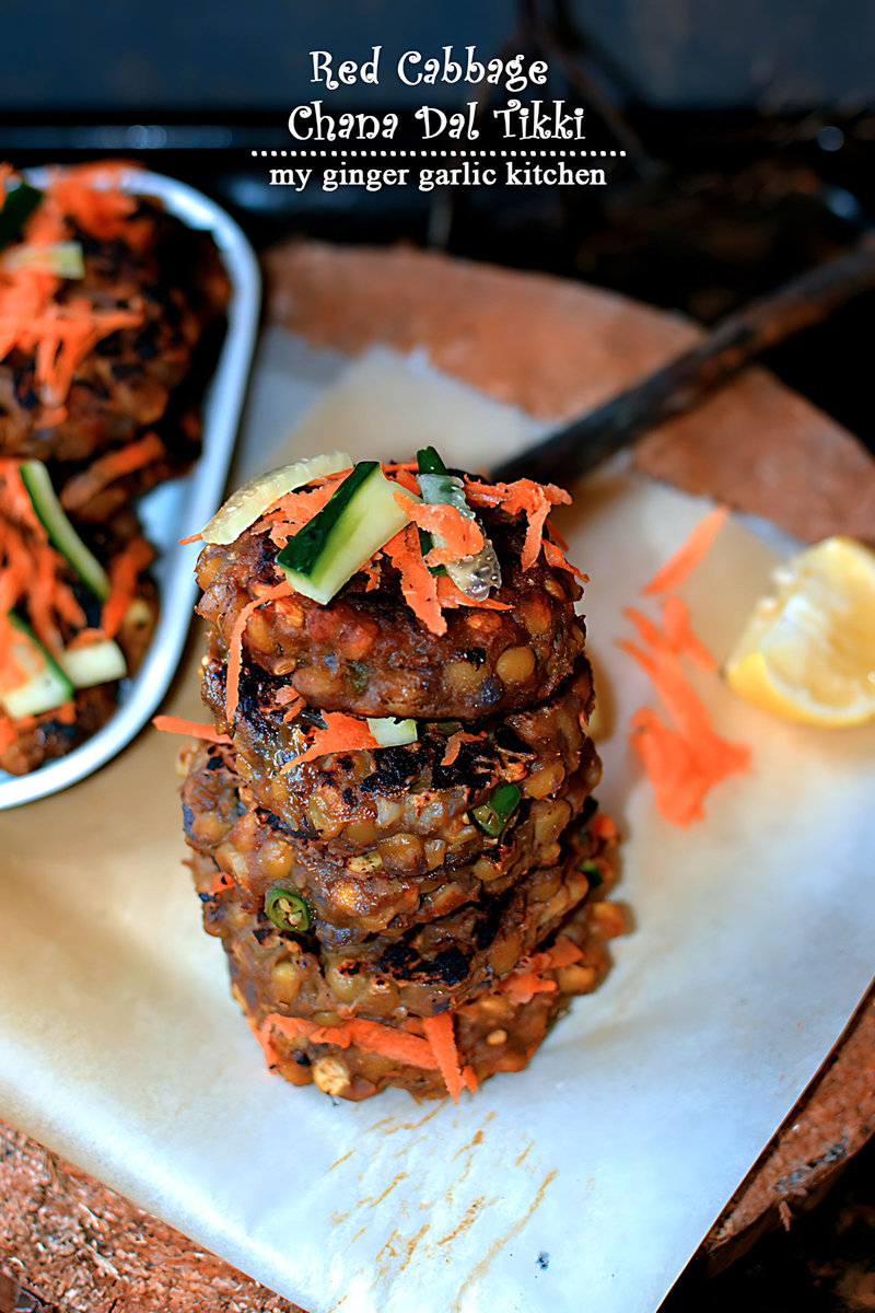 a stack of red cabbage chana dal tikkis topped with vegetables