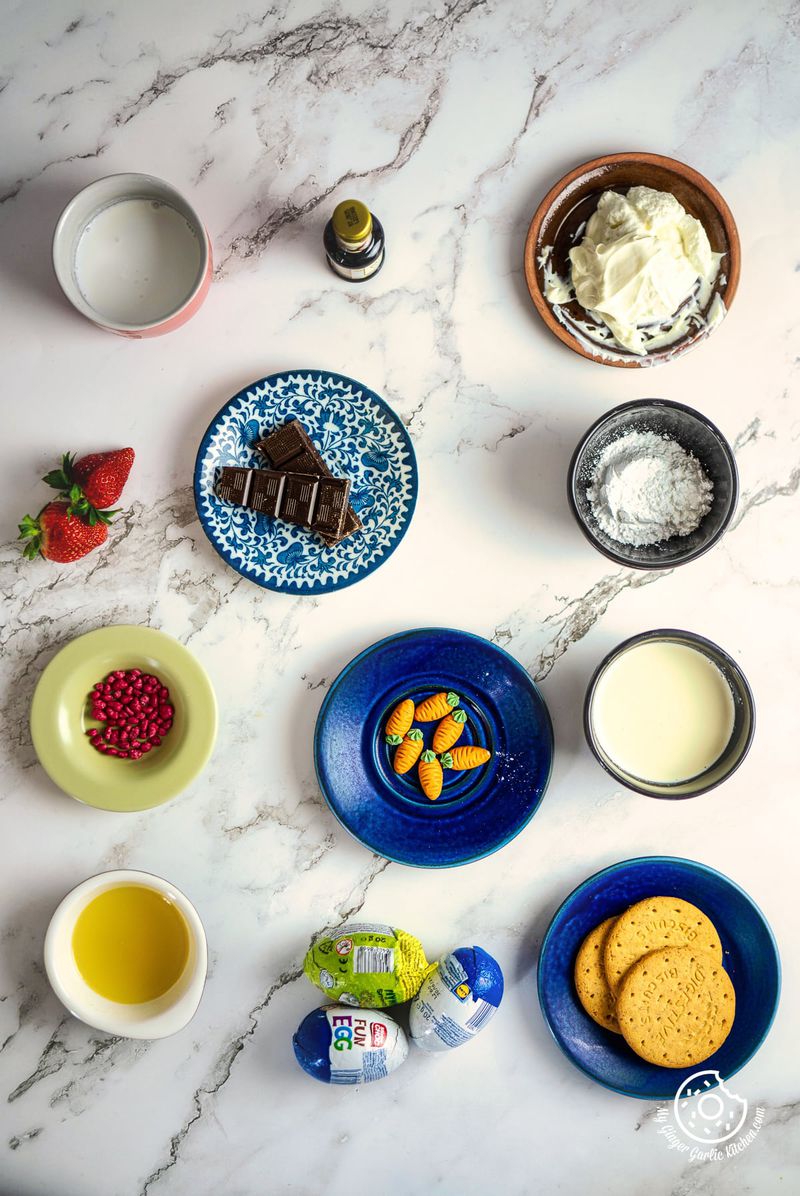 cheesecake filled easter eggs ingredients arranges on a marble surface