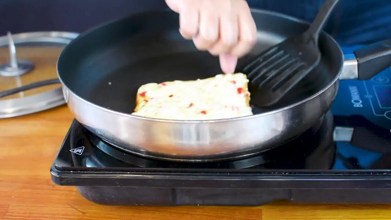 Image of the recipe cooking step-4-4 for Chilli Cheese Toast