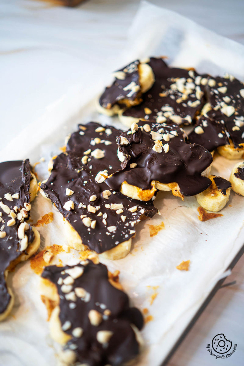 closeup photo of photo of chocolate banana bark garnished with peanuts