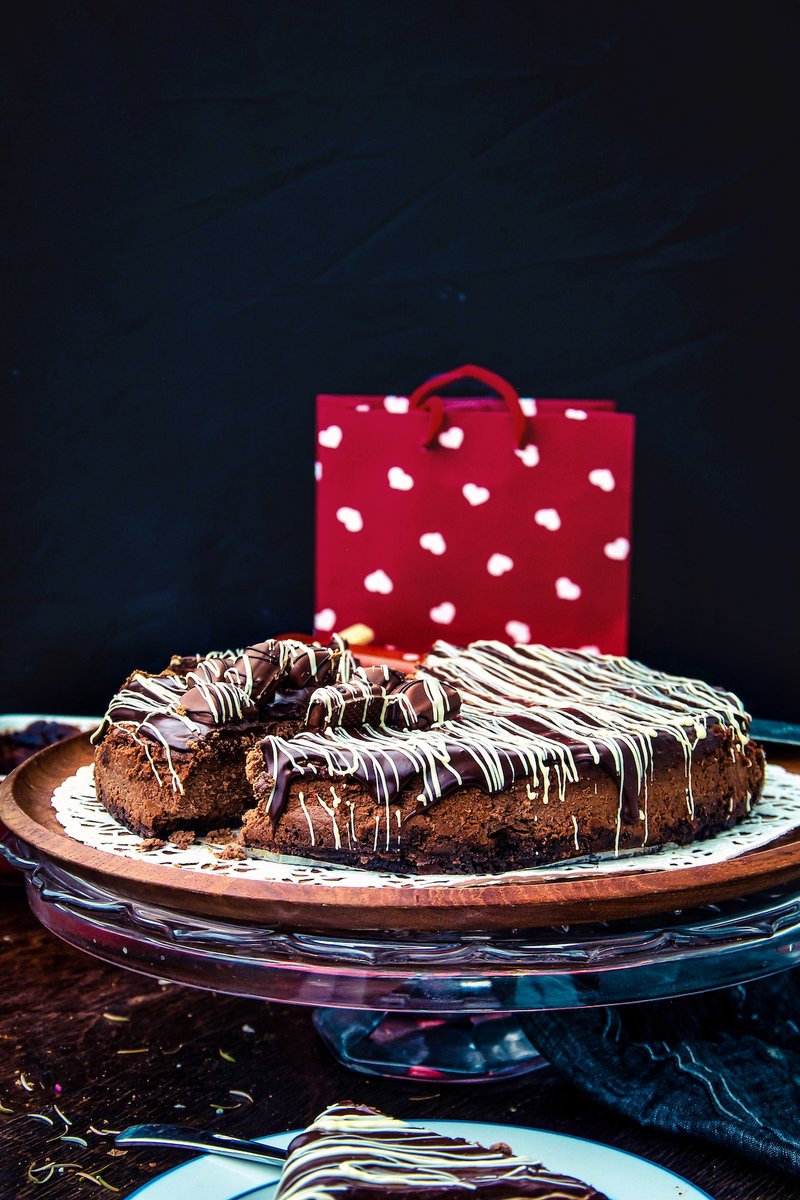 Baked Chocolate Cheesecake with chocolate cookie crust and glossy chocolate ganache topping