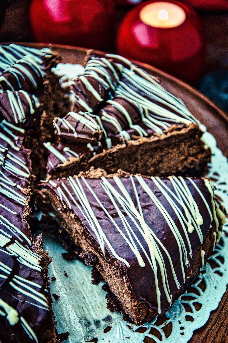 Close-up of rich and creamy Chocolate Cheesecake topped with silky chocolate ganache