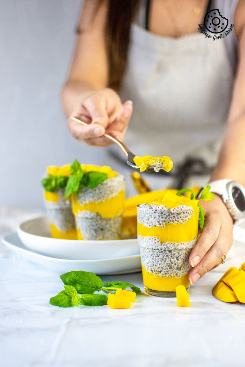 coconut mango chia pudding served in a glass