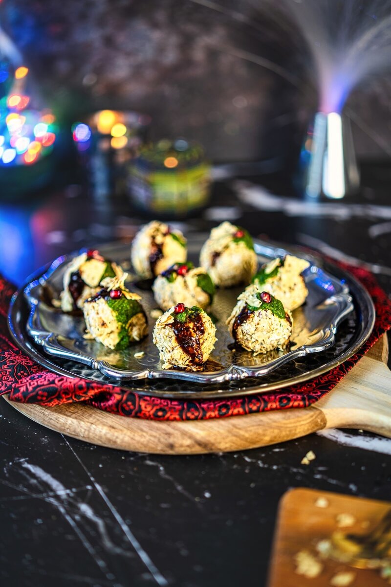Cream Cheese Corn Chaat Balls served on a festive silver tray with lights in the background. An easy 5-minute vegetarian Diwali appetizer full of sweet, spicy, and tangy flavors.