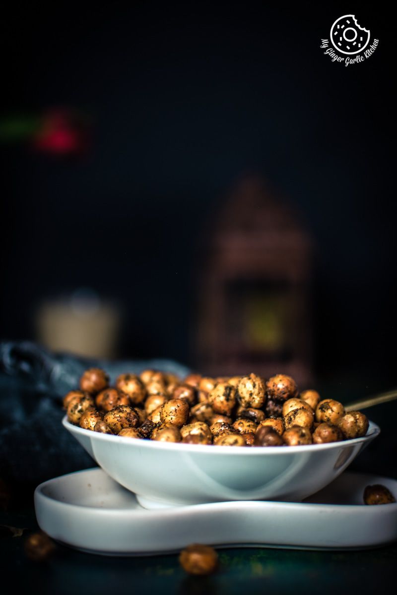 there is a bowl of crispy chana on a plate with a spoon