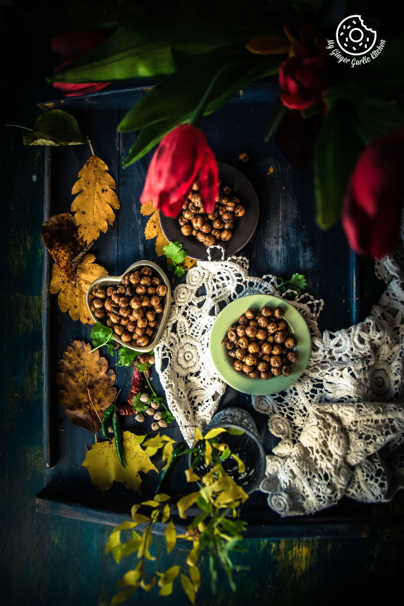 there are crispy chana and flowers on a tray with lace