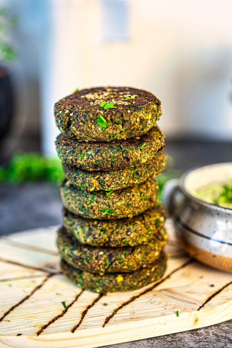 Stack of crispy black bean veggie patties high protein vegetarian burger patties