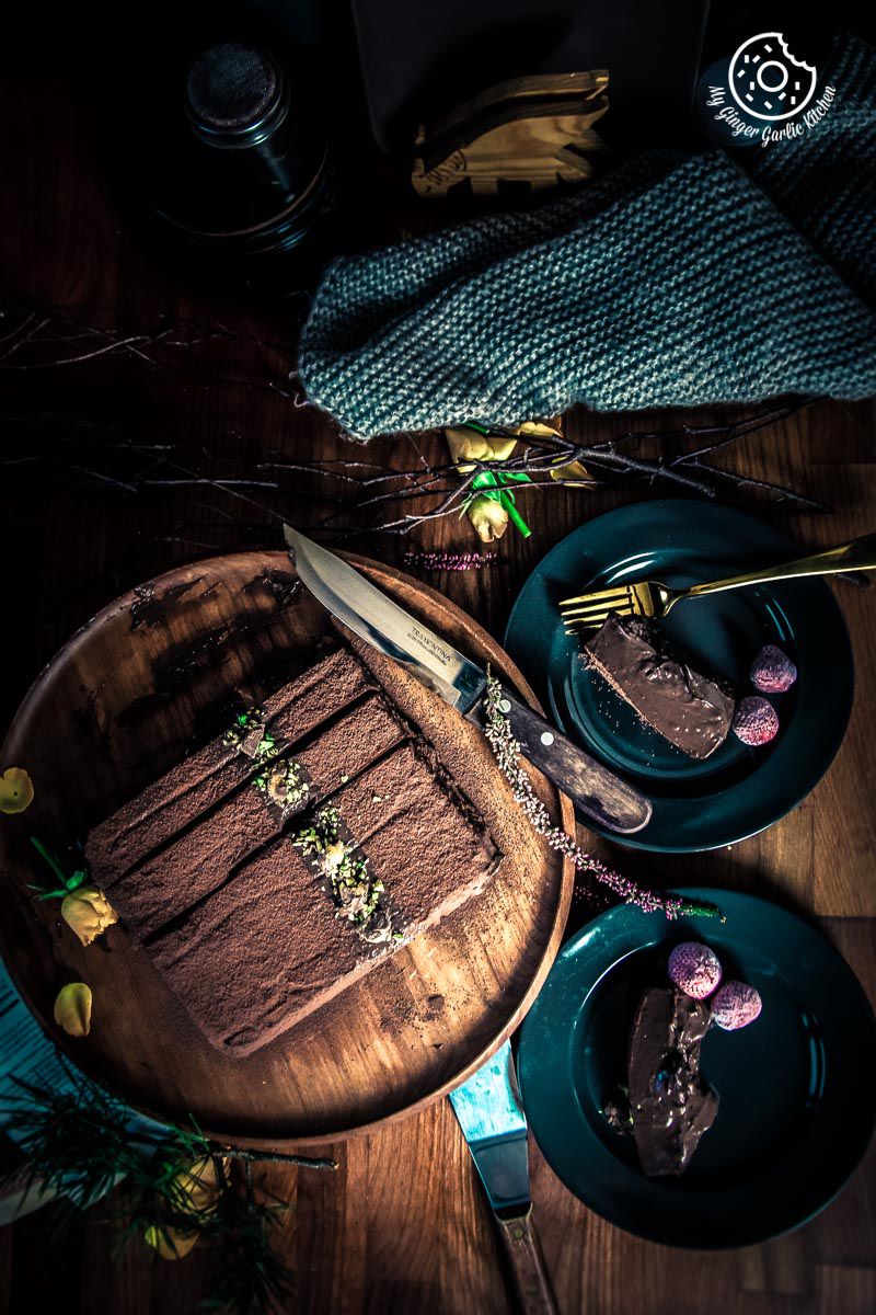 eggless mousse cake on a plate with a knife and fork