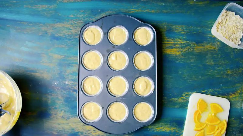 Image of the recipe cooking step-1-6 for Orange Olive Oil Muffins Recipe - Eggless
