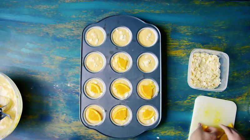Image of the recipe cooking step-1-7 for Orange Olive Oil Muffins Recipe - Eggless