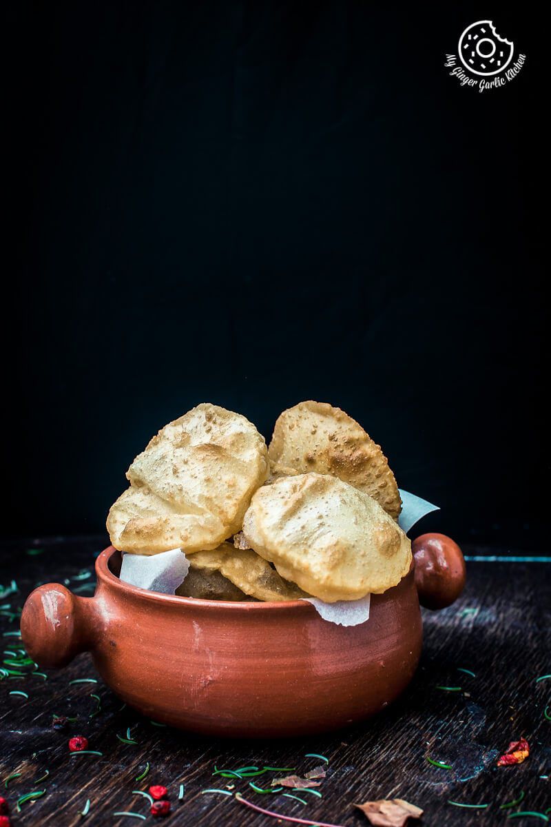 there is a bowl of puffed puris that is sitting on a table