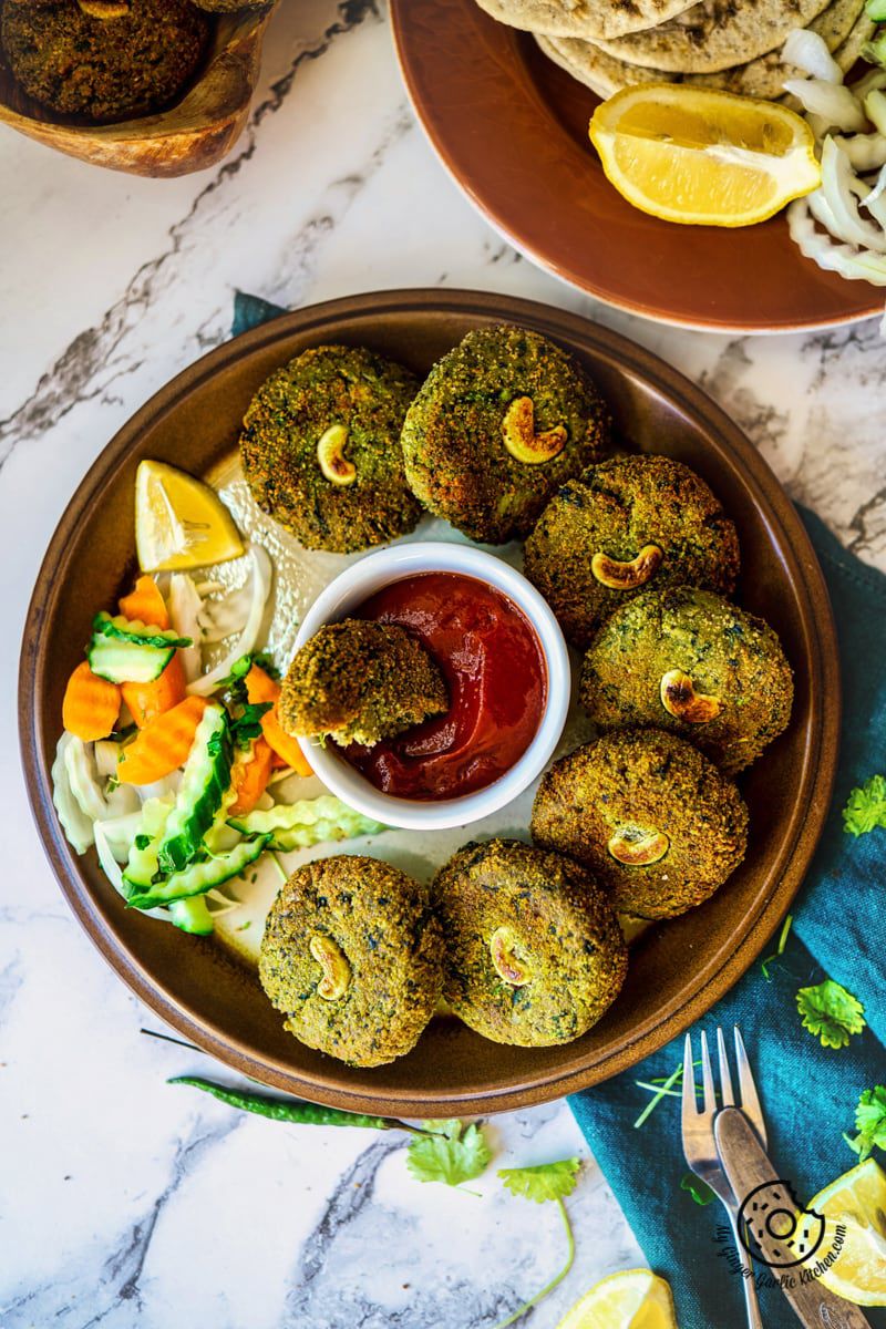 overhead shot of crispy hara bhara kabab with tomato ketchup