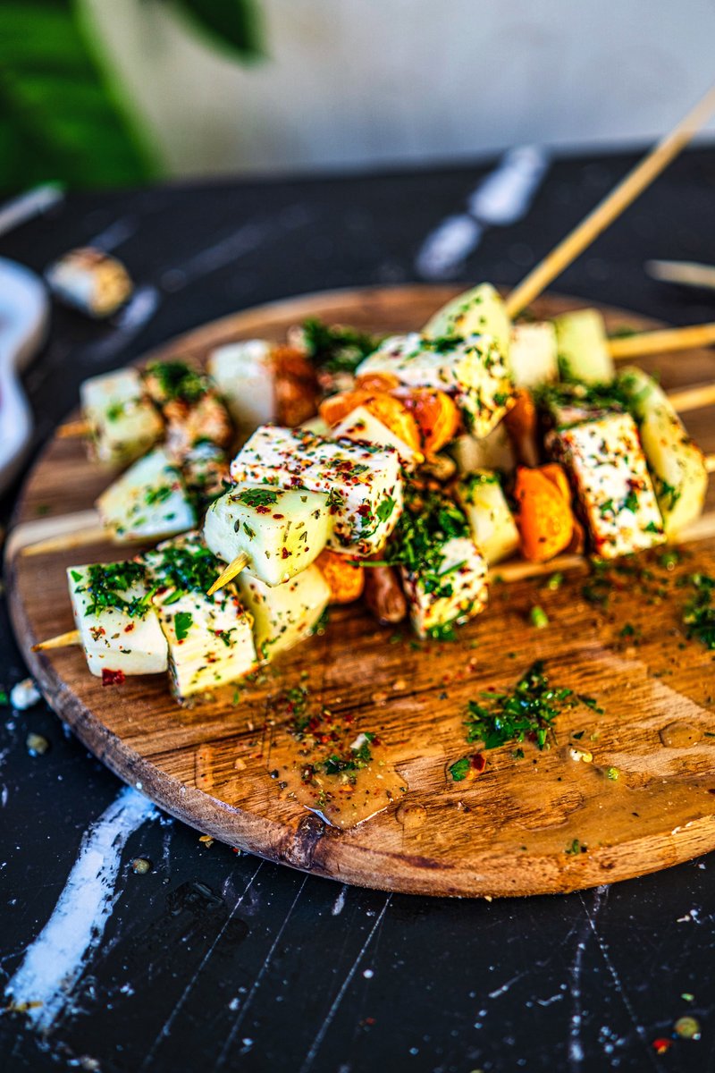 Honeydew Melon Feta Skewers with orange mustard vinaigrette served on a wooden board, an easy and refreshing summer appetizer