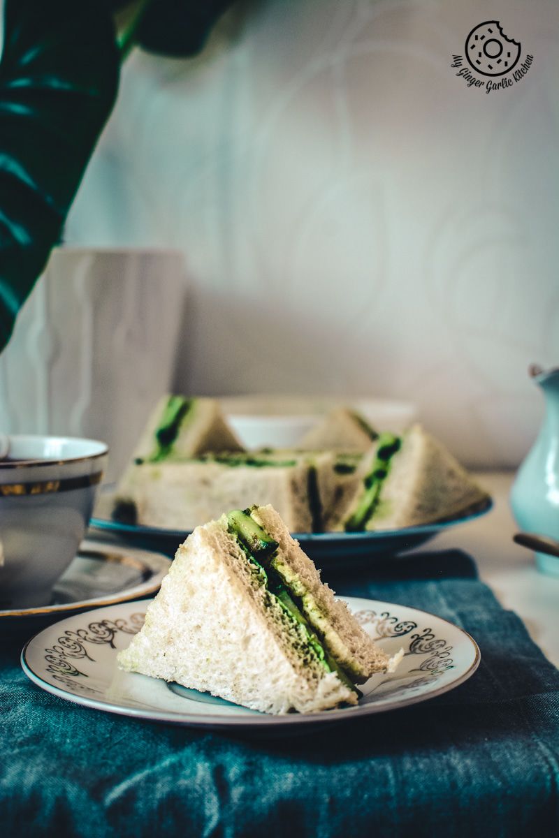 there are two indian cucumber chutney sandwiches on a plate on a table