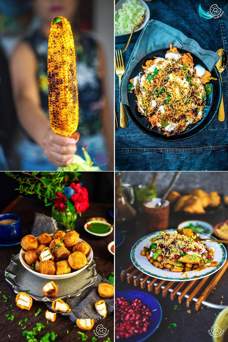 A collage of four vibrant Indian street food dishes, featuring a grilled corn on the cob aka masala bhutta, a pan of savory chaat with drizzles of yogurt and chutney, a bowl of stuffed paneer pakora, and a plate of samosa chaat with fine sev topping.