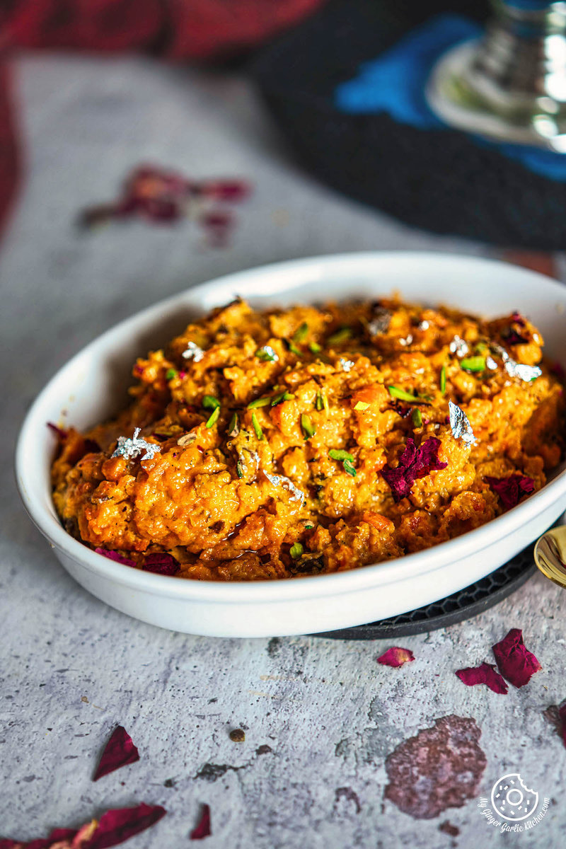 a bowl of instant gajar halwa with a spoon on the table