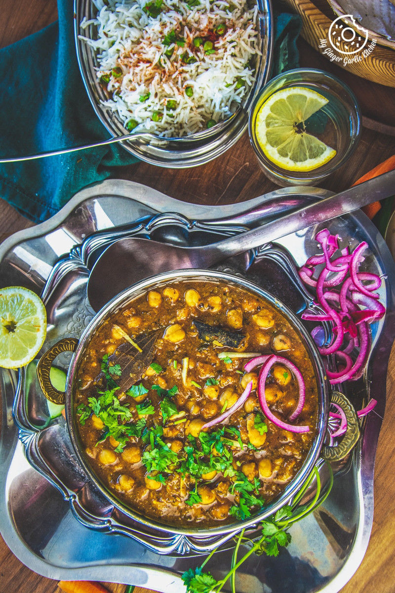instant pot chole masala served in a copper bowl