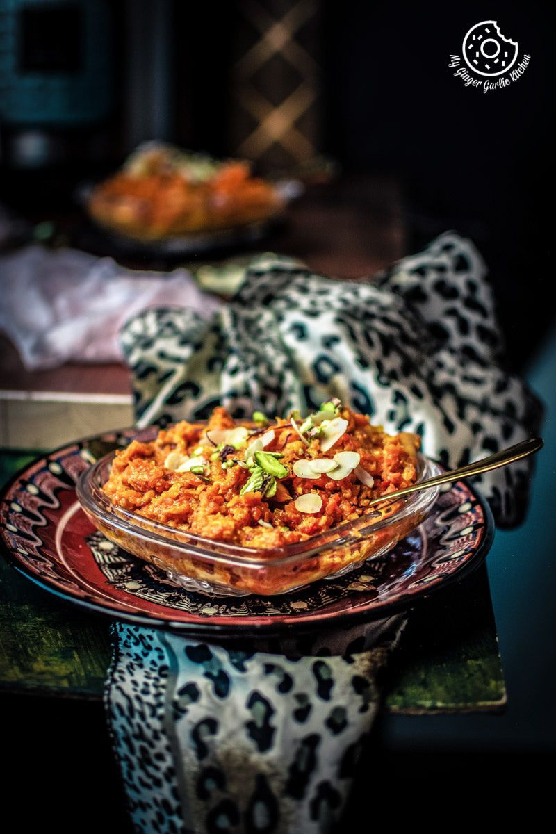 a plate of instant pot gajar halwa on a table with a napkin