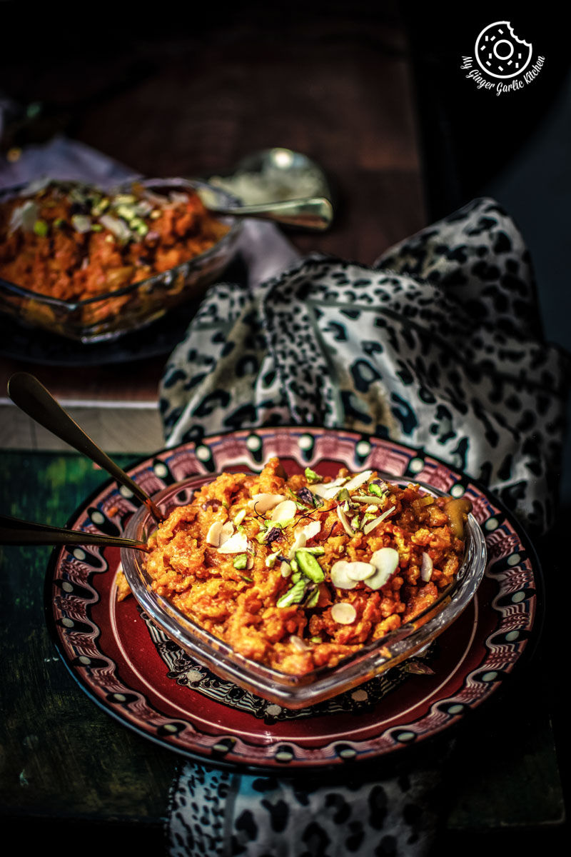 a bowl of instant pot gajar halwa on a plate on a table