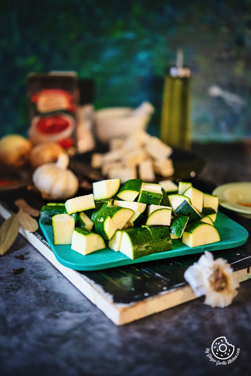 diced zucchini on a green chopping board