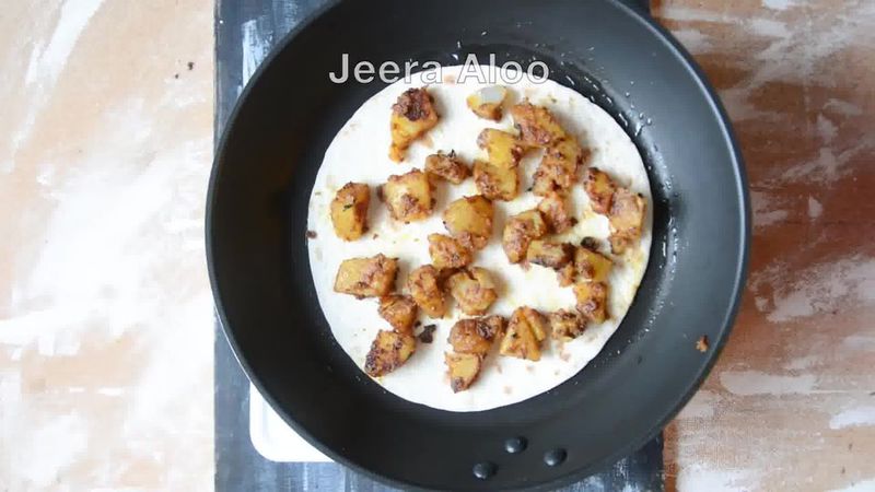 Image of the recipe cooking step-1-10 for Jeera Aloo Quesadilla