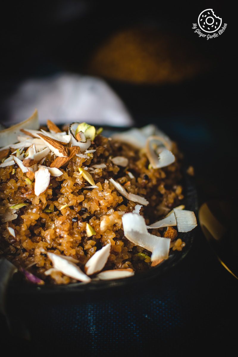 there is a bowl of a rajasthani lapsi with coconut nuts and other toppings