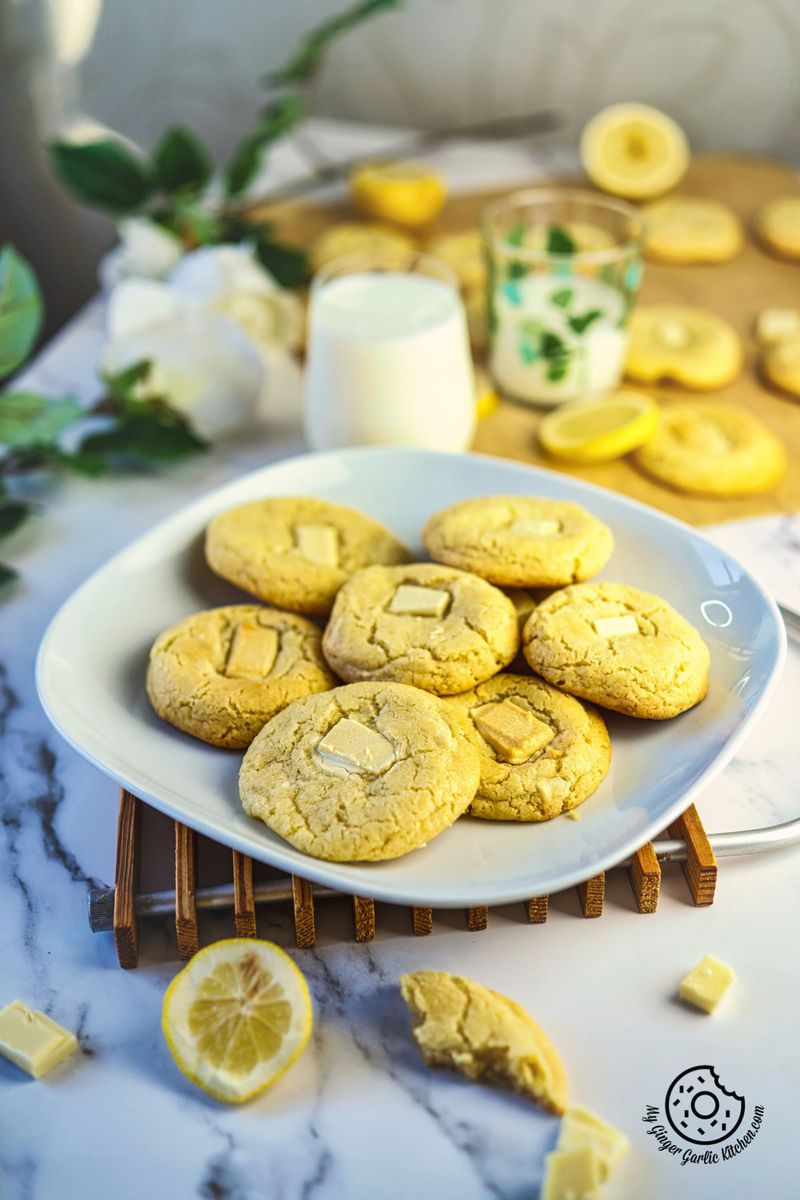 Lemon White Chocolate Cookies. Soft and chewy lemon sugar cookies with with chunks of white chocolate in a white plate.